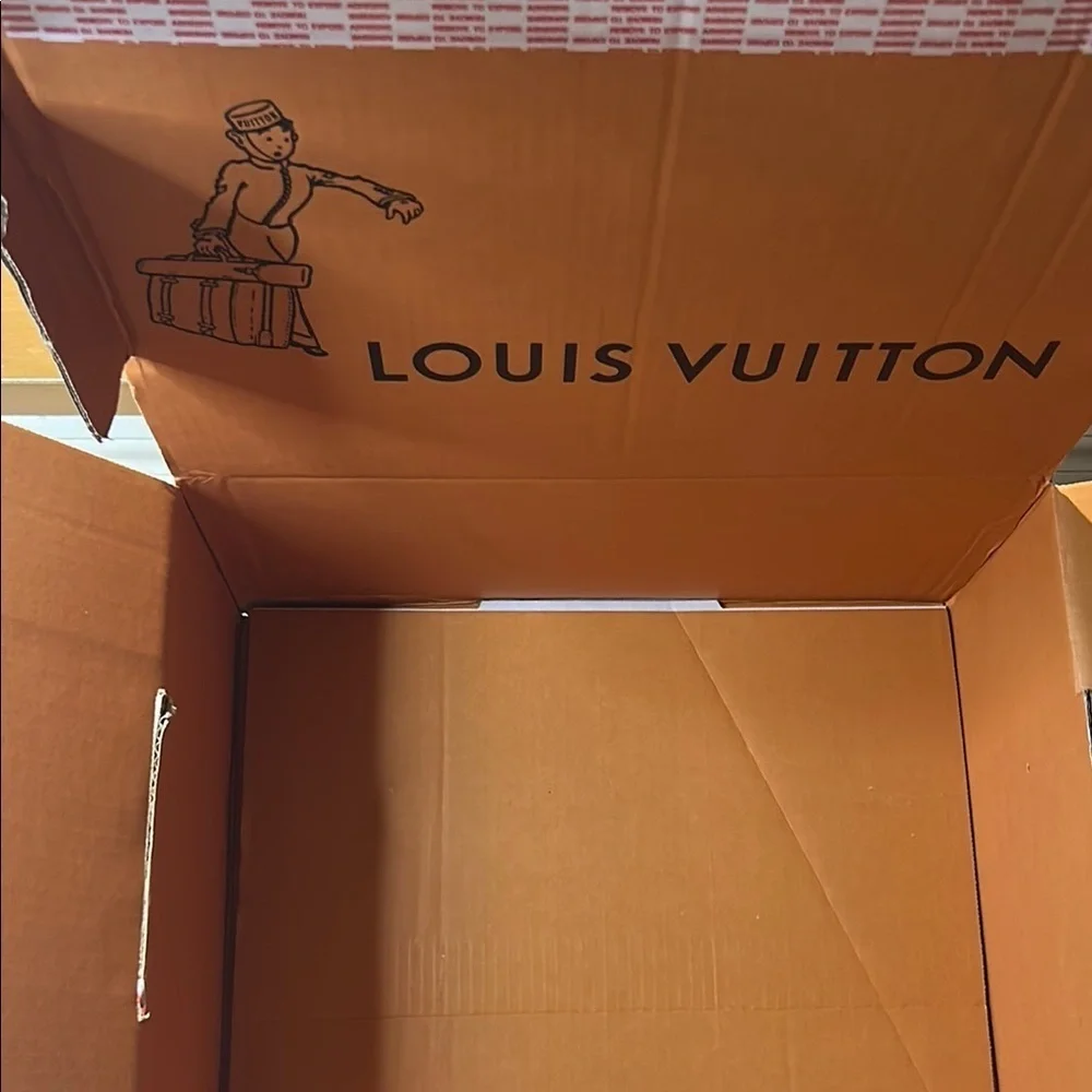 Louis Vuitton Signature  Box inside a LV shipping box with tissue and ribbon.